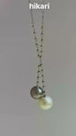 Double Pearl Blazing Chain. The necklace features a 9mm Tahitian Sea Blue Pearl and a 10mm Australian White Pearl.
双珠爆闪链 项链大溪地海蓝珠9mm. 白珠是澳白 10mm. 金属部位都是18k金、小金球也是18k金. 链长50cm 可调节 翻译英文
a
